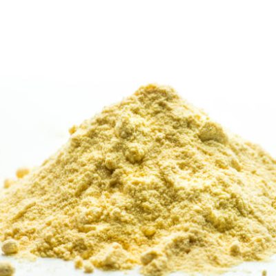 light yellow powder on a white background
